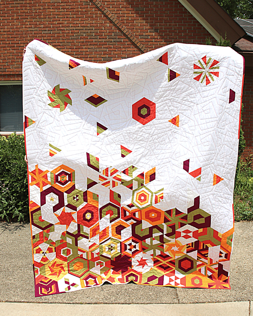 full show of IMQG's 2022 QuiltCon Community Outreach Challenge quilt, outdoors